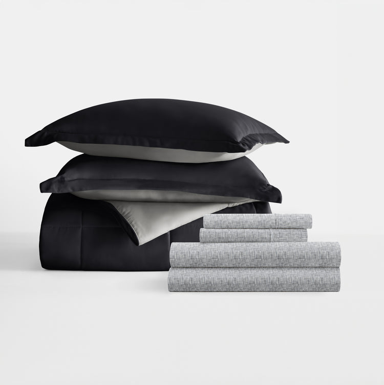 Black/Fog Reversible Comforter with Chambray Light Gray Pattern Sheets